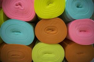 Artistic variety of shade tone colors Textile Fabrics rolls stacked pattern texture photo