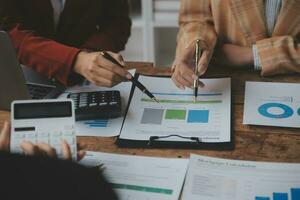 Team of business people working together in the meeting room office, teamwork background charts and graphs banner, double exposure successful teamwork,business planning concept. photo