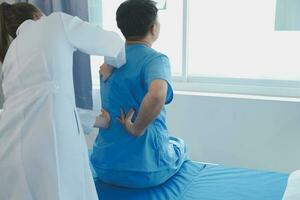 Patient doing some special exercises under supervision in a room photo