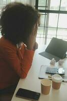 Close up Business woman using calculator and laptop for do math finance on wooden desk, tax, accounting, statistics and analytical research concept photo