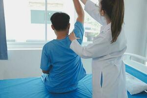 Women Asian doctors hold the patient hand and encourage and provide medical advice While checking the patient health in bed. Concept of Care and compassion, antenatal care, Threatened abortion photo