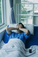 Terminally Ill Male Patient Lies on a Bad In the Hospital. Melancholy and Exhausted Patient in the Palliative Care Ward. photo