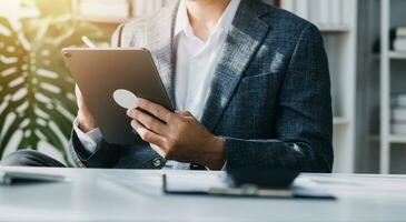 Audit concept,Administrator business man financial inspector and secretary making report calculating balance. Internal Revenue Service checking document. photo