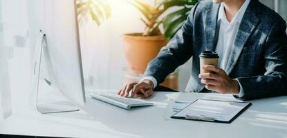 Audit concept,Administrator business man financial inspector and secretary making report calculating balance. Internal Revenue Service checking document. photo