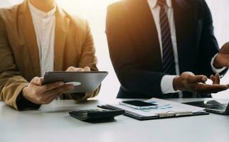 Audit concept,Administrator business man financial inspector and secretary making report calculating balance. Internal Revenue Service checking document. photo