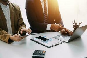 Audit concept,Administrator business man financial inspector and secretary making report calculating balance. Internal Revenue Service checking document. photo