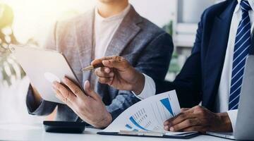 Audit concept,Administrator business man financial inspector and secretary making report calculating balance. Internal Revenue Service checking document. photo