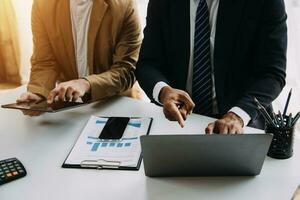 Audit concept,Administrator business man financial inspector and secretary making report calculating balance. Internal Revenue Service checking document. photo