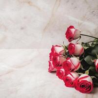 a bouquet of red roses on a floor photo