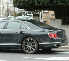 Closeup of Sleek Exotic Luxury Car In Motion photo
