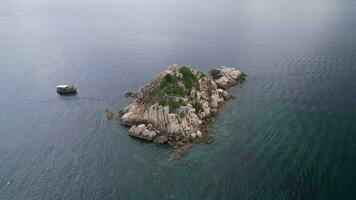 4K Aerial Drone Footage of Shark Island on Koh Tao , Featuring Rock Pinnacle In the Ocean video