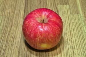 red apples, fresh fruit just picked from the tree on the table photo