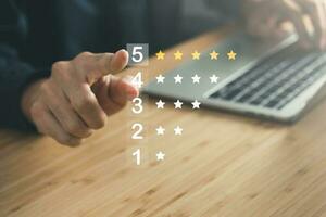 Business man point five stars survey rating icon for customer satisfaction scores. customer satisfaction concept. photo