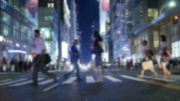 Crowds of people commuting in the city crossing street in rush hour traffic video