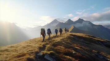 Group of hikers walks in mountains at early morning. photo