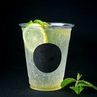 Cocktail with lemon, mint and ice on a black background photo