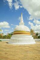 Ruwanwali maha saya white stupa with blue sky and white clouds in Anuradhapuraya, Sri lanka. photo