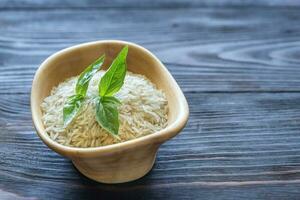 Bowl of uncooked basmati rice photo