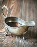 Maple syrup in vintage sauce boat photo