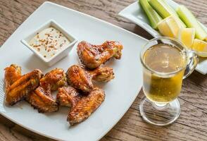 Caramelized chicken wings with spicy sauce photo