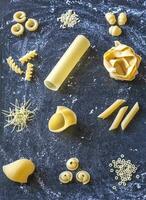 Various types of raw pasta photo