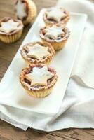 Mince pies with Christmas tree branch photo