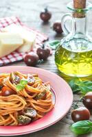 Portion of spaghetti with cherry tomatoes photo