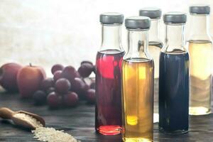 Bottles with different kinds of vinegar photo