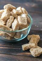 Glass bowl of brown sugar photo