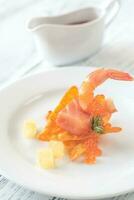 Corn chip with shrimps and salmon photo