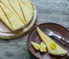 Portion of lemon tart on the plate photo