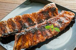 Grilled pork ribs with tomatoes photo