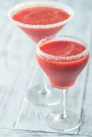 Two glasses of strawberry margarita cocktail photo