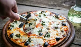 Cooked pizza on the wooden board photo