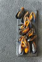 Cooked mussels on the board photo