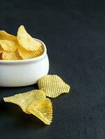 Potato chips in the glass bowl photo