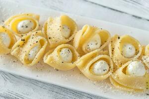 Lumaconi pasta stuffed with bocconcini photo