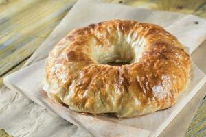 Meatball Wellington ring with tomato sauce photo