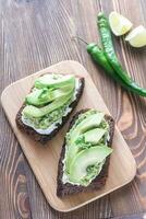 Toasts with cream cheese and guacamole photo