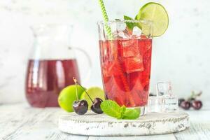 Glass of cherry mojito photo