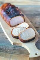Pork loin wrapped in bacon photo