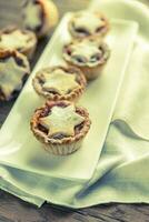 Mince pies with Christmas tree branch photo