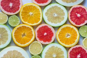 Slices of citrus fruits top view photo