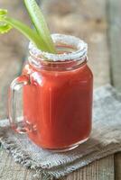 Tomato juice in the mason jar photo