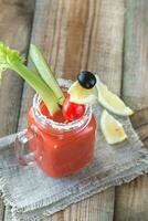Tomato juice in the mason jar photo