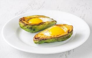 Baked eggs in avocado photo