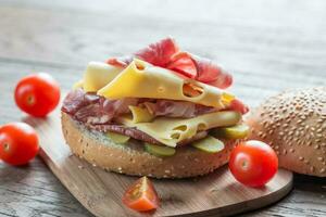 Sandwich with  ham, cheese and cherry tomatoes photo