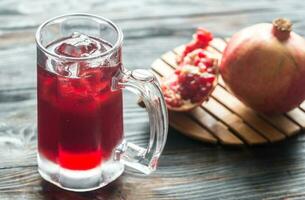 Glass of pomegranate juice photo