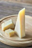 Grana Padano cheese on the wooden board photo