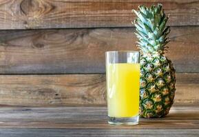 Glass of pineapple juice photo